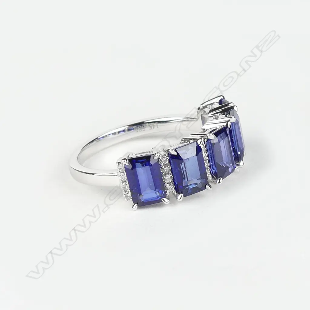 A 14ct white gold sapphire and diamond ring Image 1++