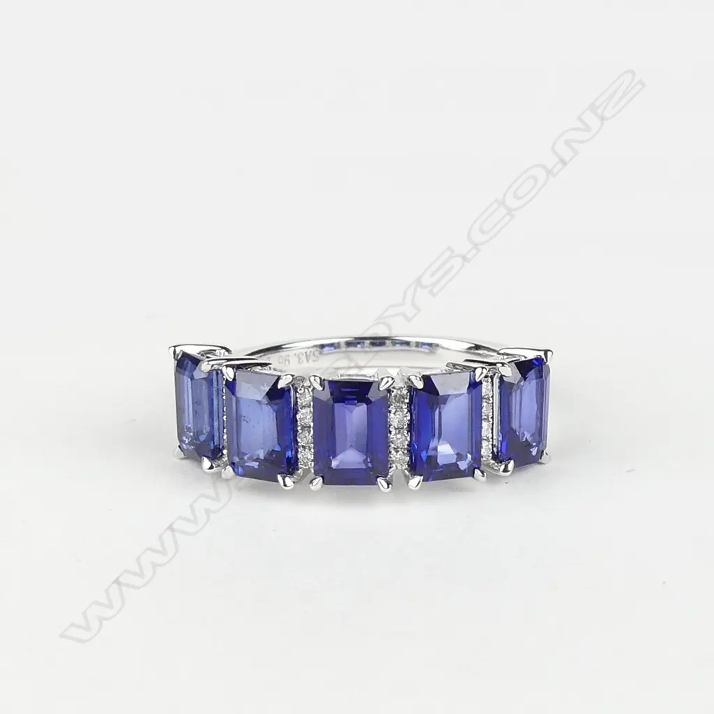 A 14ct white gold sapphire and diamond ring Image 1++