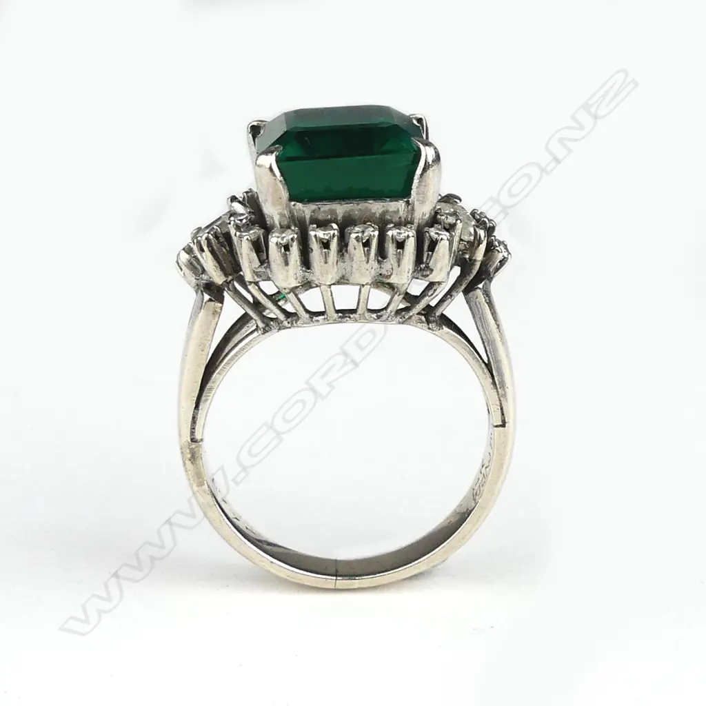 A diamond and faux emerald ring Image 1++
