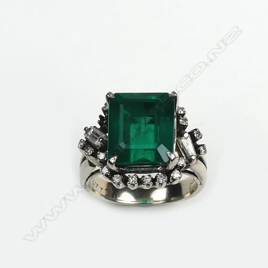 A diamond and faux emerald ring Image 1++