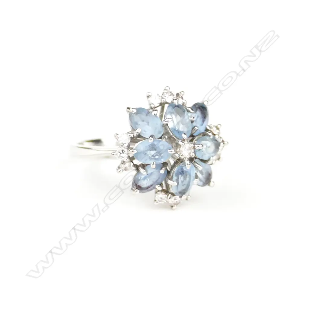 An 18ct white gold diamond and aquamarine ring Image 1++