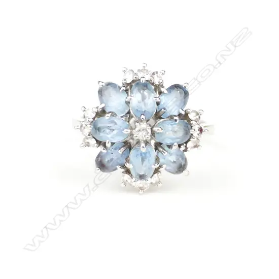 An 18ct white gold diamond and aquamarine ring