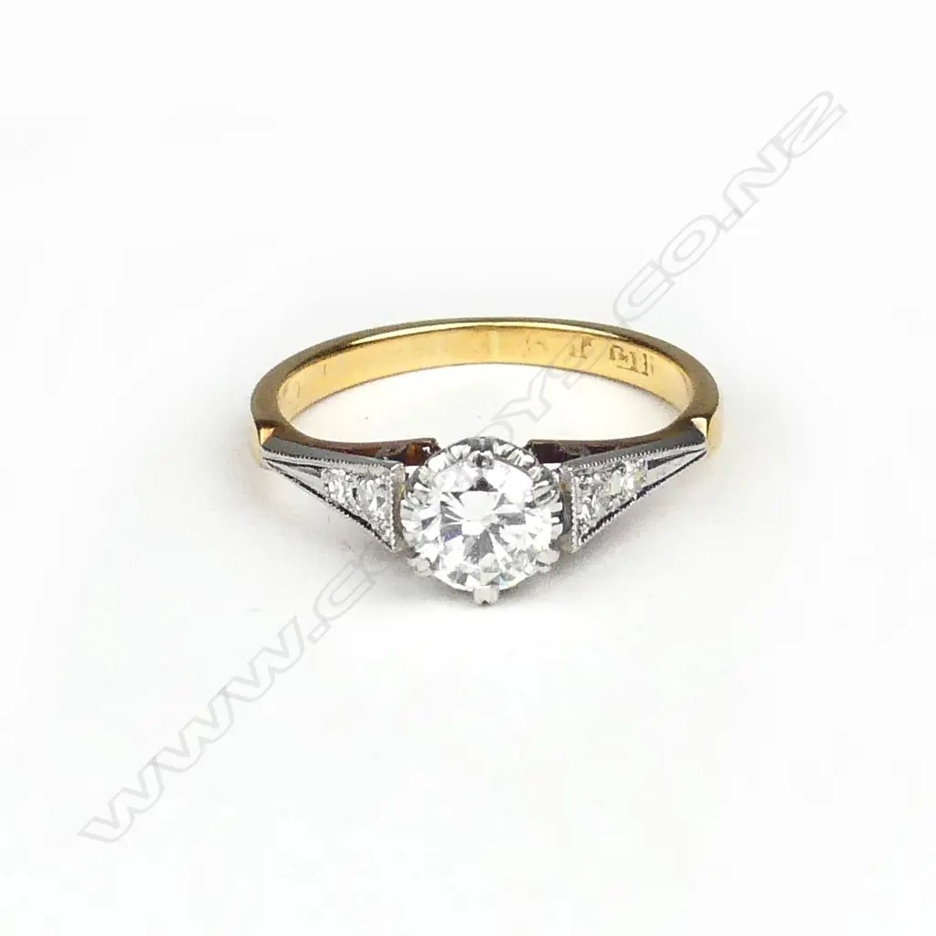 A vintage 18ct gold and diamond solitaire ring Image 1++