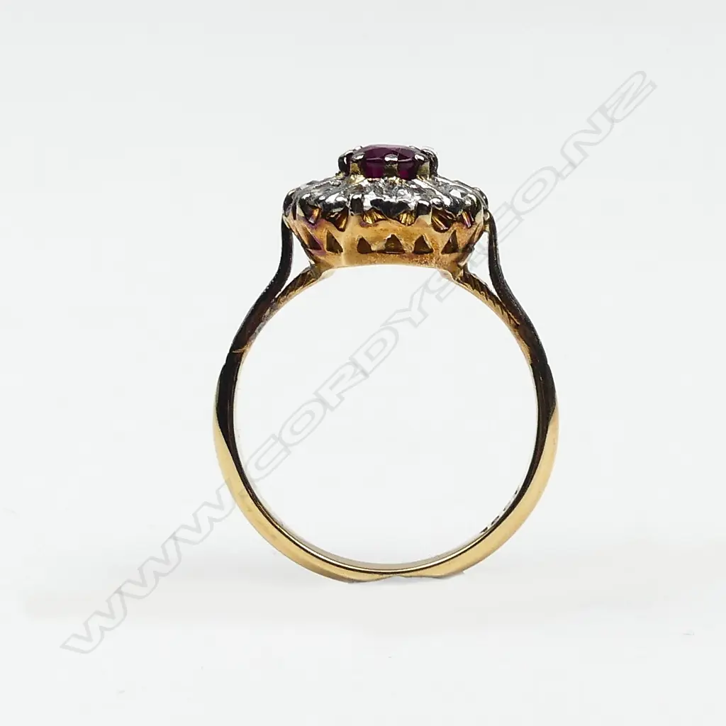 An estate 18ct gold ruby and diamond cluster ring Image 1++