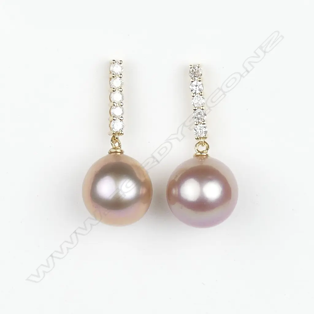 A pair of 14ct gold diamond and pearl drop earrings Image 1++