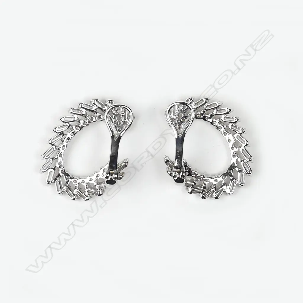 A pair of 18ct. white gold and multi-diamond C-scroll form earrings Image 1++