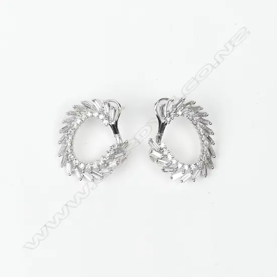 A pair of 18ct. white gold and multi-diamond C-scroll form earrings