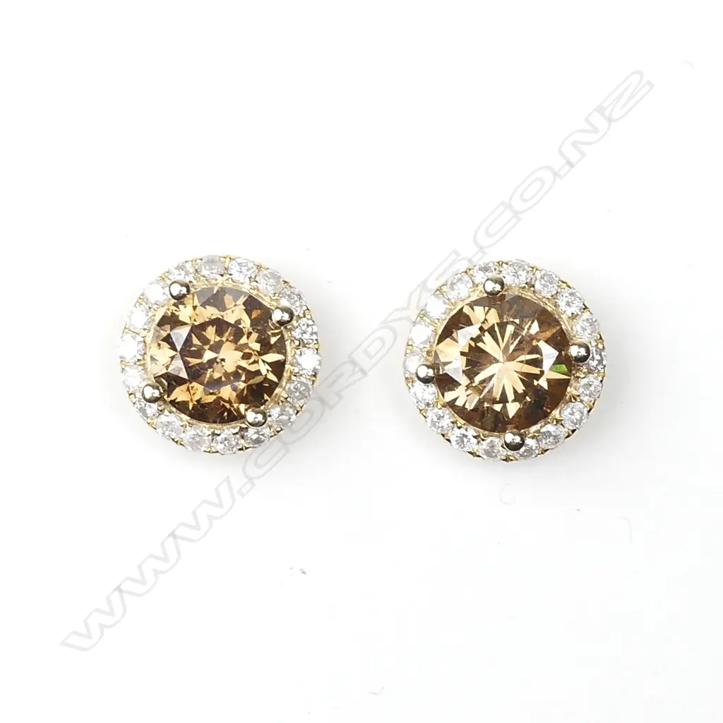 A pair of 14ct gold and diamond cluster earrings Image 1++