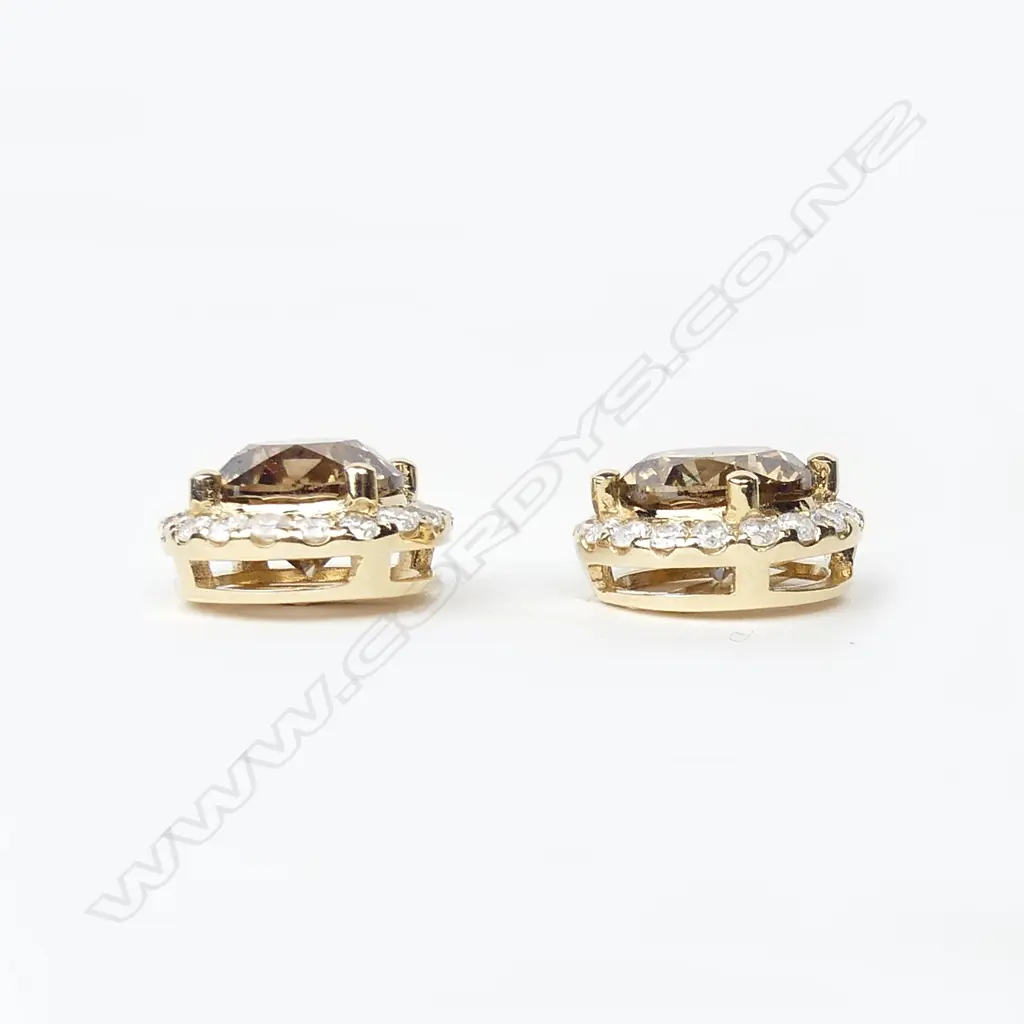 A pair of 14ct gold and diamond cluster earrings Image 1++