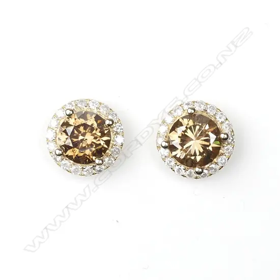 A pair of 14ct gold and diamond cluster earrings