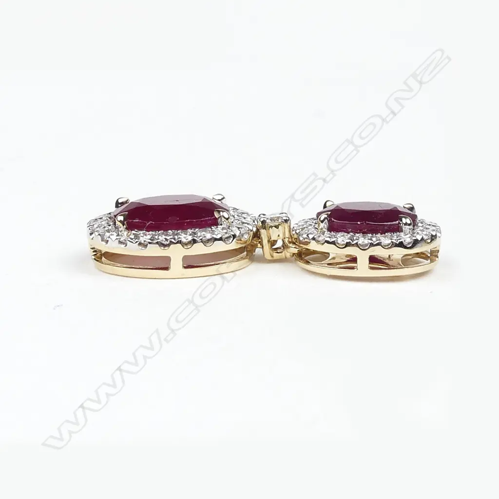 A pair of 14ct gold ruby and diamond drop earrings Image 1++