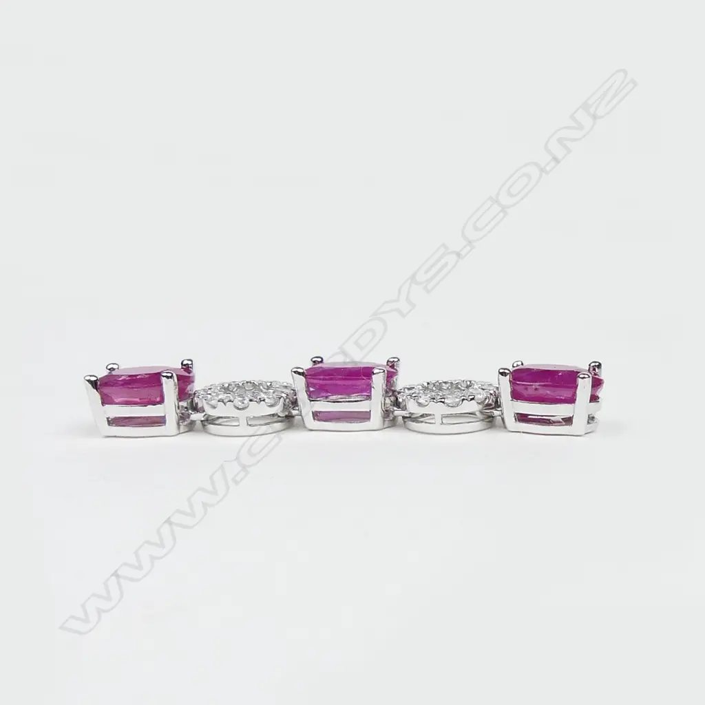A pair of 14ct white gold ruby and diamond drop earrings Image 1++