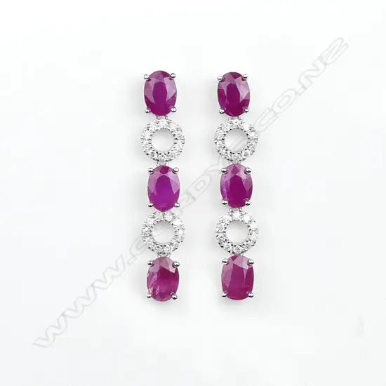 A pair of 14ct white gold ruby and diamond drop earrings