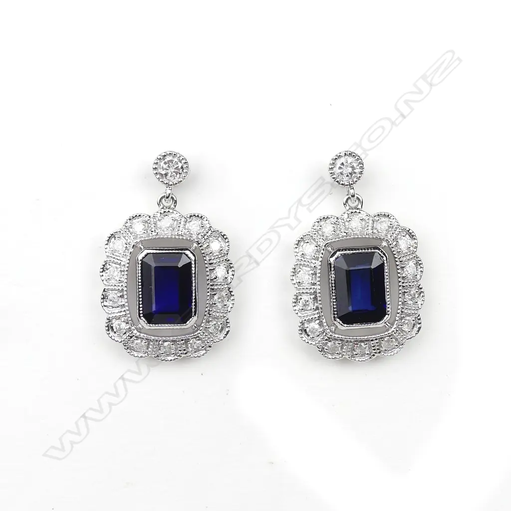 A pair of 14ct white gold sapphire and diamond earrings Image 1++