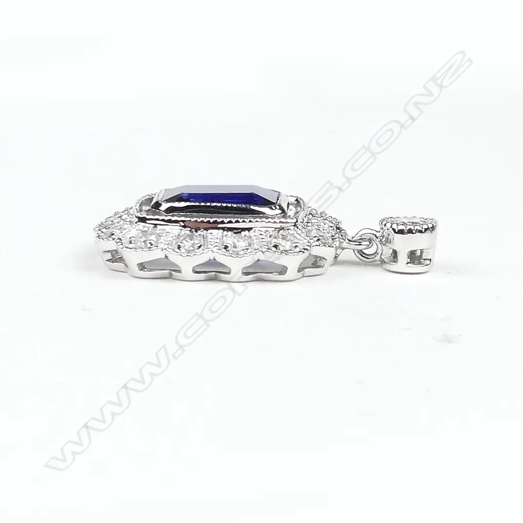 A pair of 14ct white gold sapphire and diamond earrings Image 1++