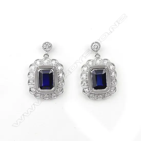 A pair of 14ct white gold sapphire and diamond earrings
