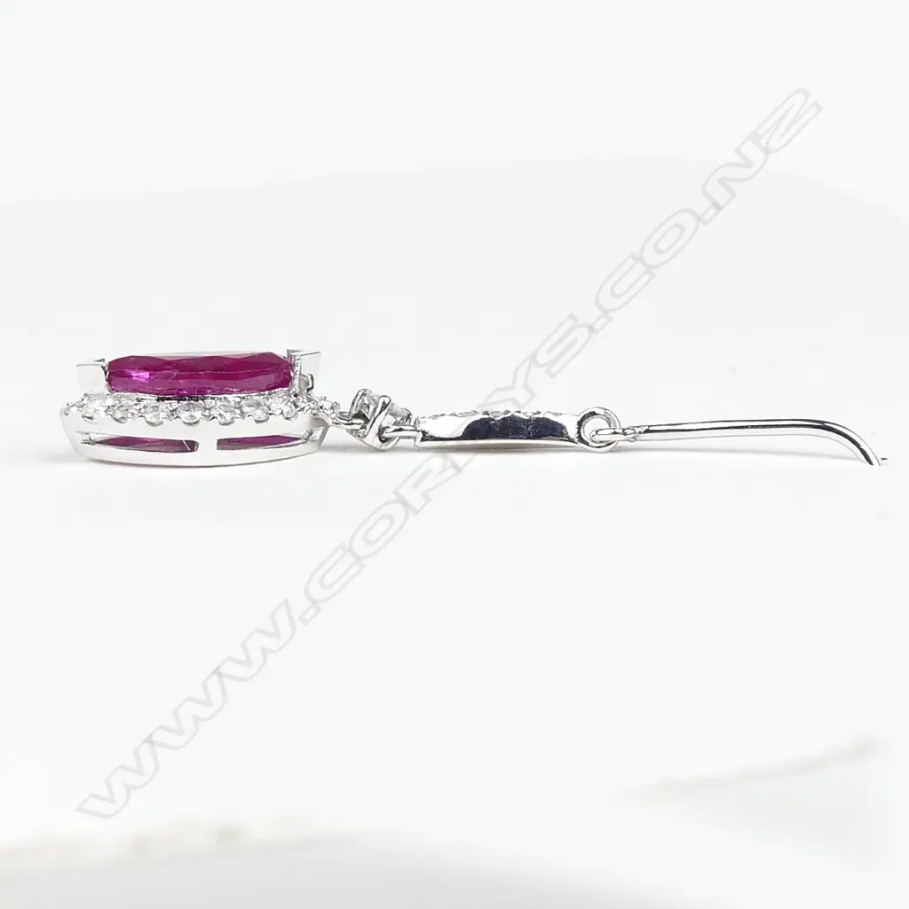 A pair of 14ct white gold ruby and diamond earrings Image 1++