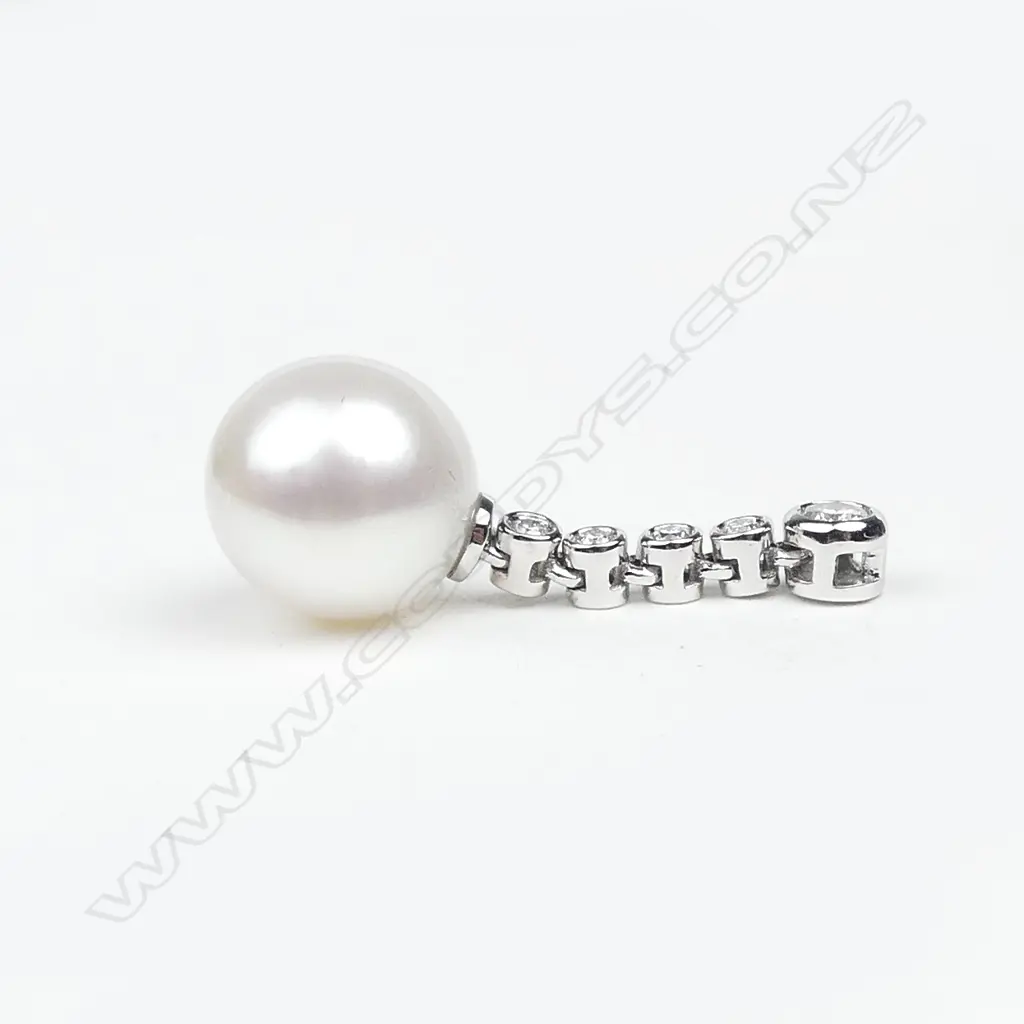A pair of 14ct white gold diamond and pearl drop earrings Image 1++