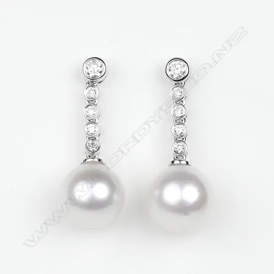 A pair of 14ct white gold diamond and pearl drop earrings