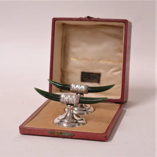 A good pair of New Zealand colonial silver and greenstone boxed knife rests