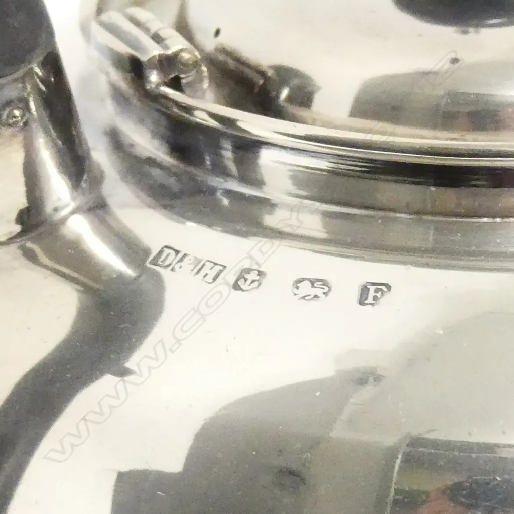 A 1930's silver three piece tea-set Image 1++
