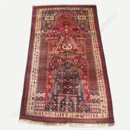 An unusually large Persian prayer rug