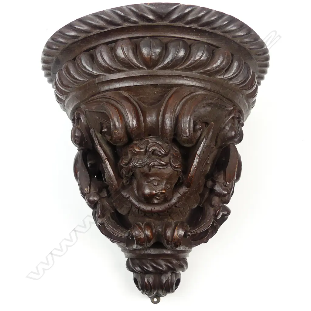 A late 19thC oak carved wall bracket Image 1++