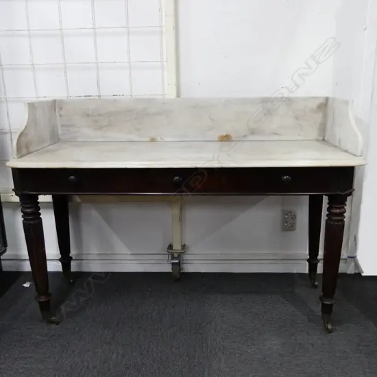 A Victorian marble top and mahogany washstand