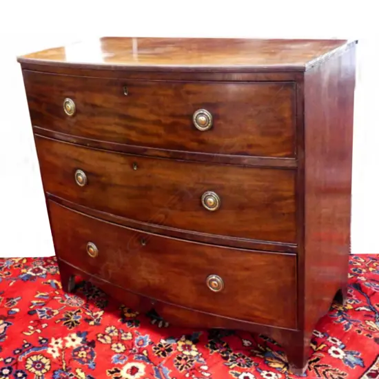 A Georgian mahogany small proportion three drawer bowfront chest