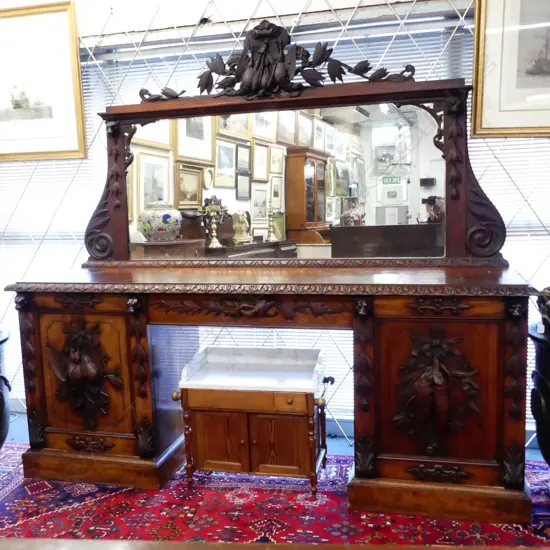 A Victorian mahogany double pedestal mirror back sideboard