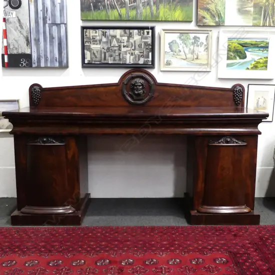 A William IV Empire style double pedestal mahogany sideboard