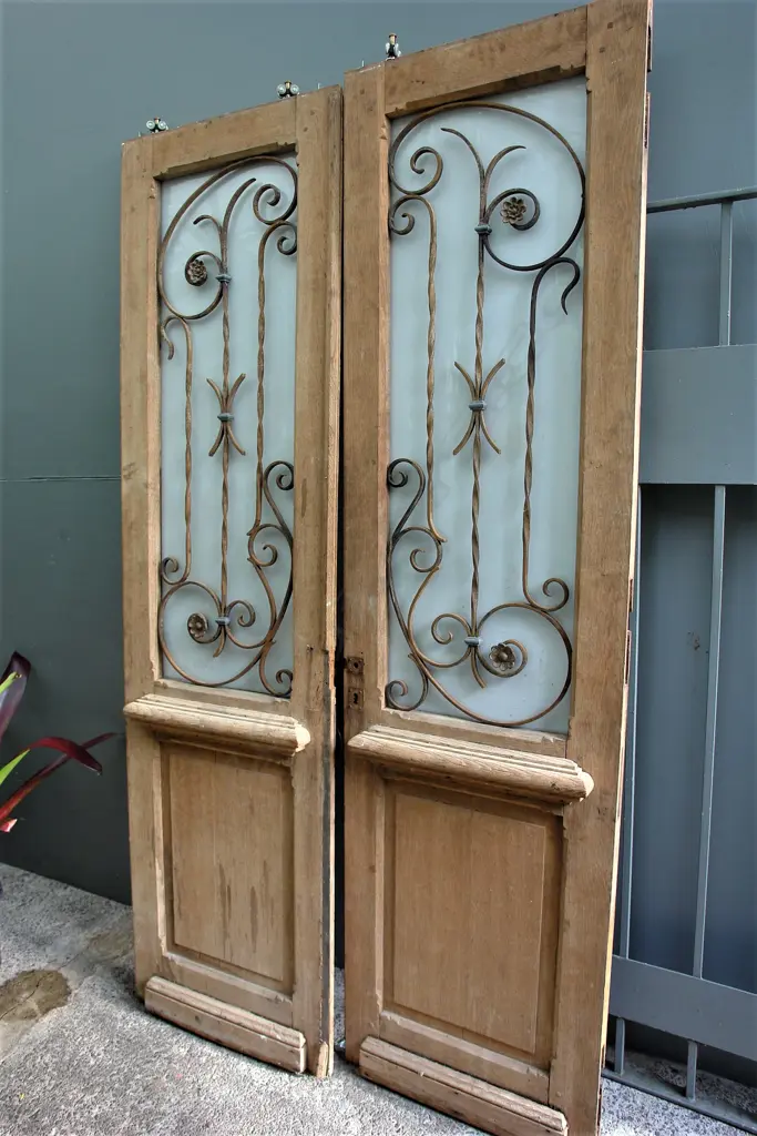 A pair of 19thC French decorative glazed and wrought iron work doors Image 1++