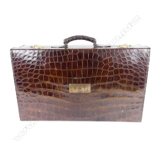 An impressive crocodile skin fitted travelling case