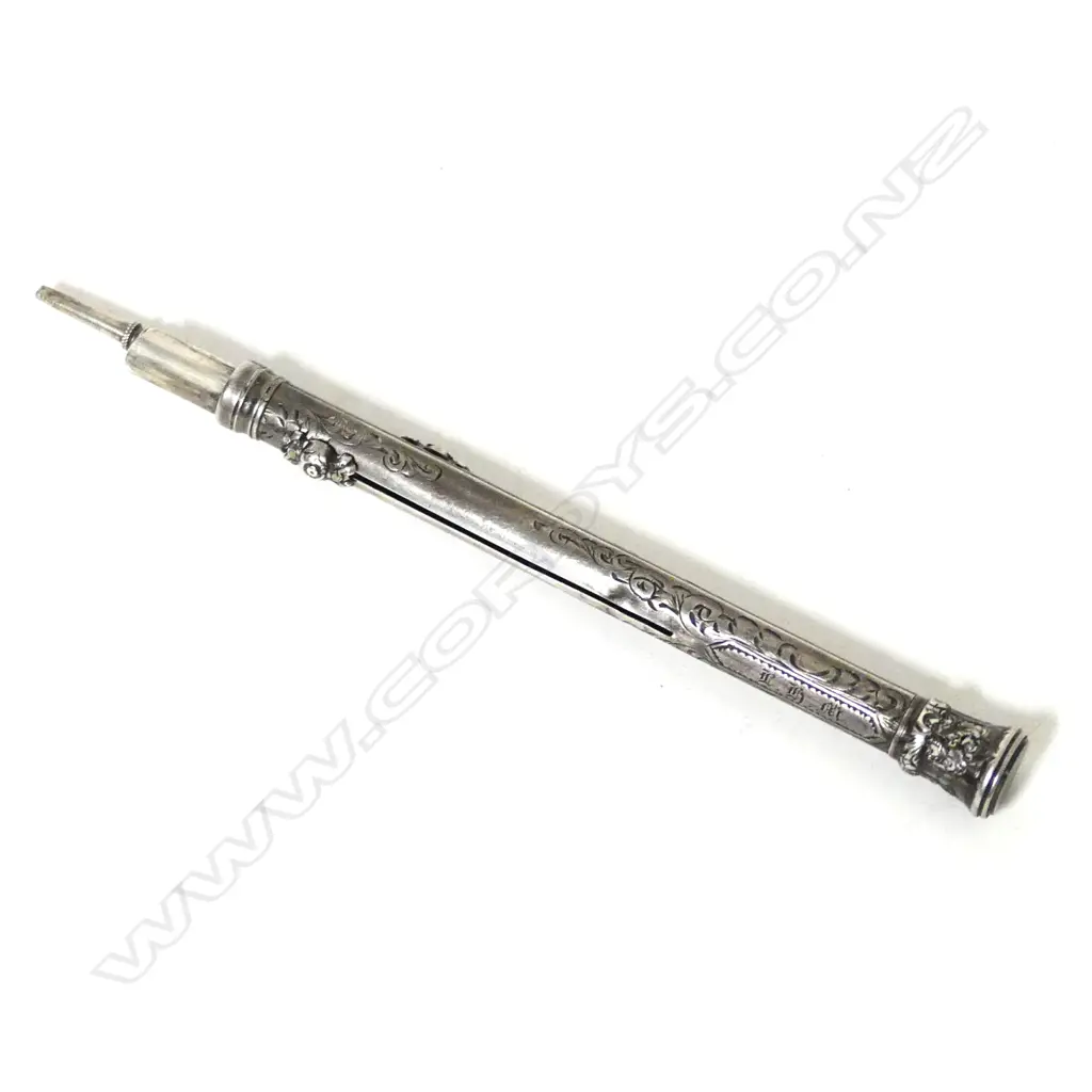 A silver propelling pen and pencil Image 1++