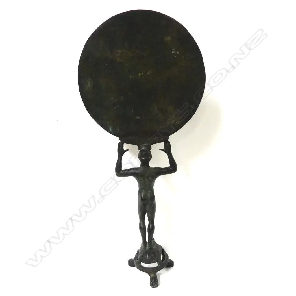 A bronze museum copy of an ancient Greek mirror Image 1++