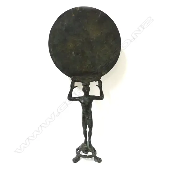 A bronze museum copy of an ancient Greek mirror