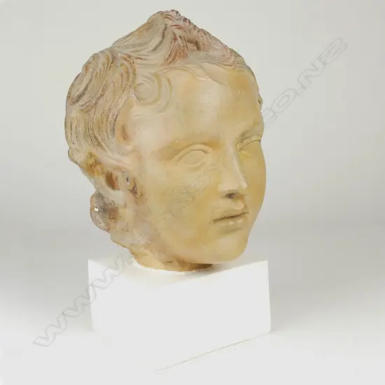 A vintage painted plaster head of a child