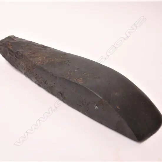 A large pre-European Maori black basalt toki (adze)