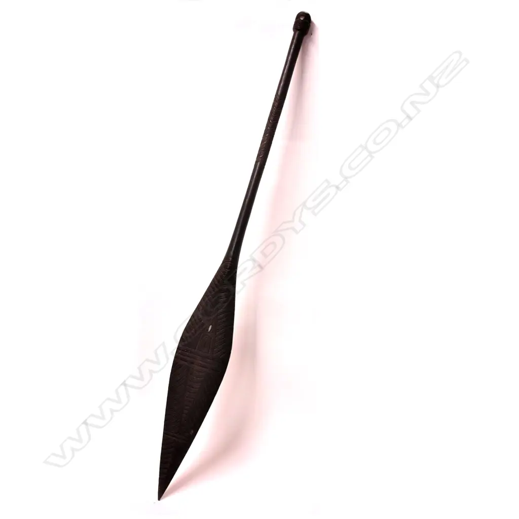 A decoratively carved Maori hoe (paddle) Image 1++
