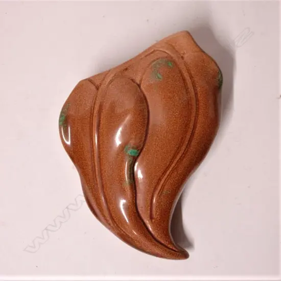 An O.C. Stephens kaka beak wall pocket vase