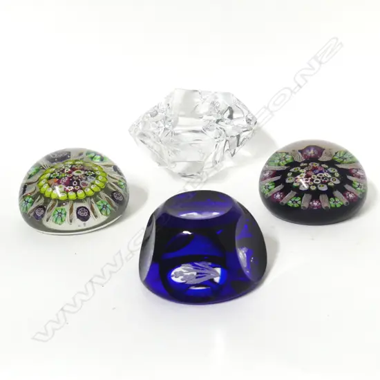 Four glass paperweights