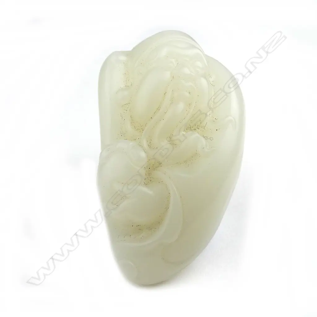 A Chinese white jade handling piece Image 1++