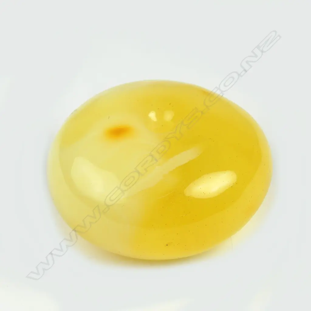 A large egg yolk amber bead of rounded flattened form Image 1++