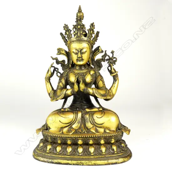 An old Chinese seated bronze of the Tibetan bodhisattva Tārā modelled with four arms