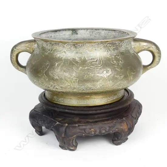 A heavy Chinese brass jardinière on stand
