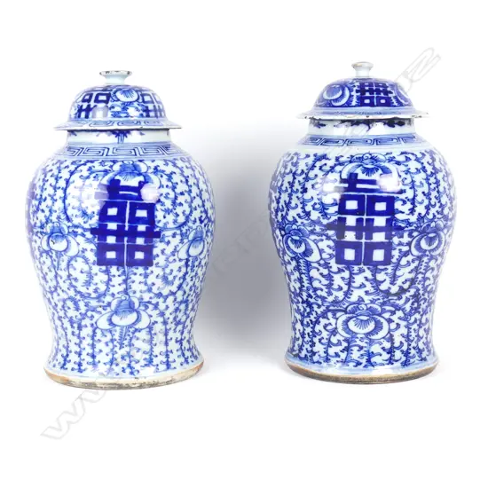A pair of large Chinese blue and white jars and covers