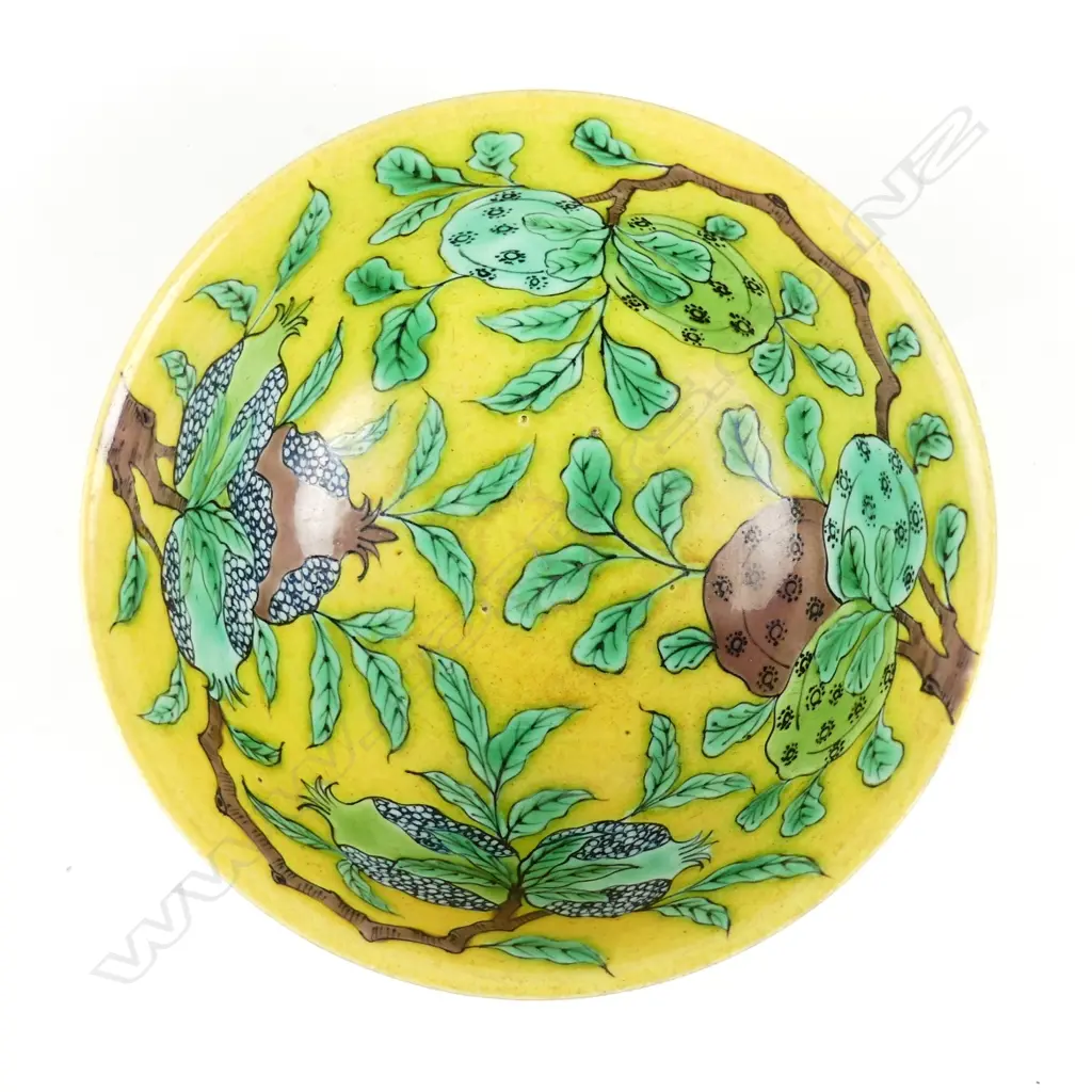 A fine Chinese yellow ground painted and sgraffito decorated bowl Image 1++