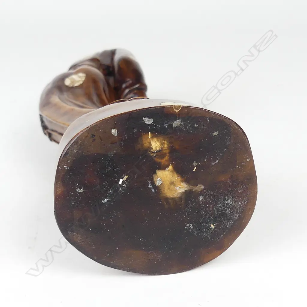 A rosewood and simulated ivory figure of a woman Image 1++