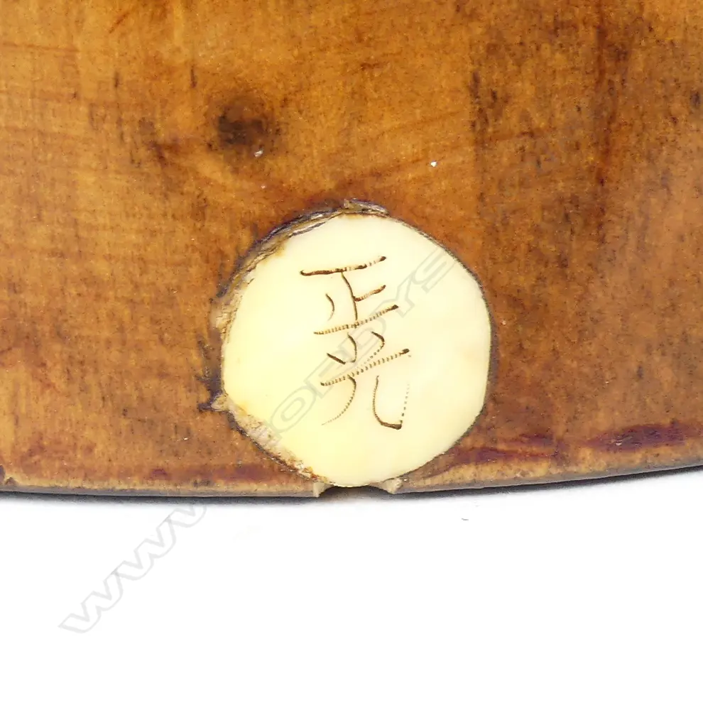 A rosewood and simulated ivory figure of a woman Image 1++