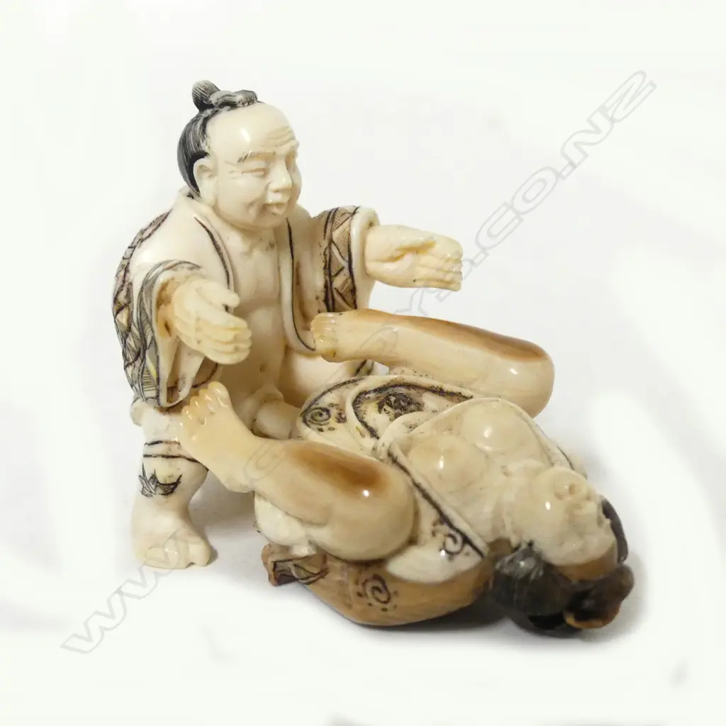 A small Japanese ivory two piece erotic carving Image 1++